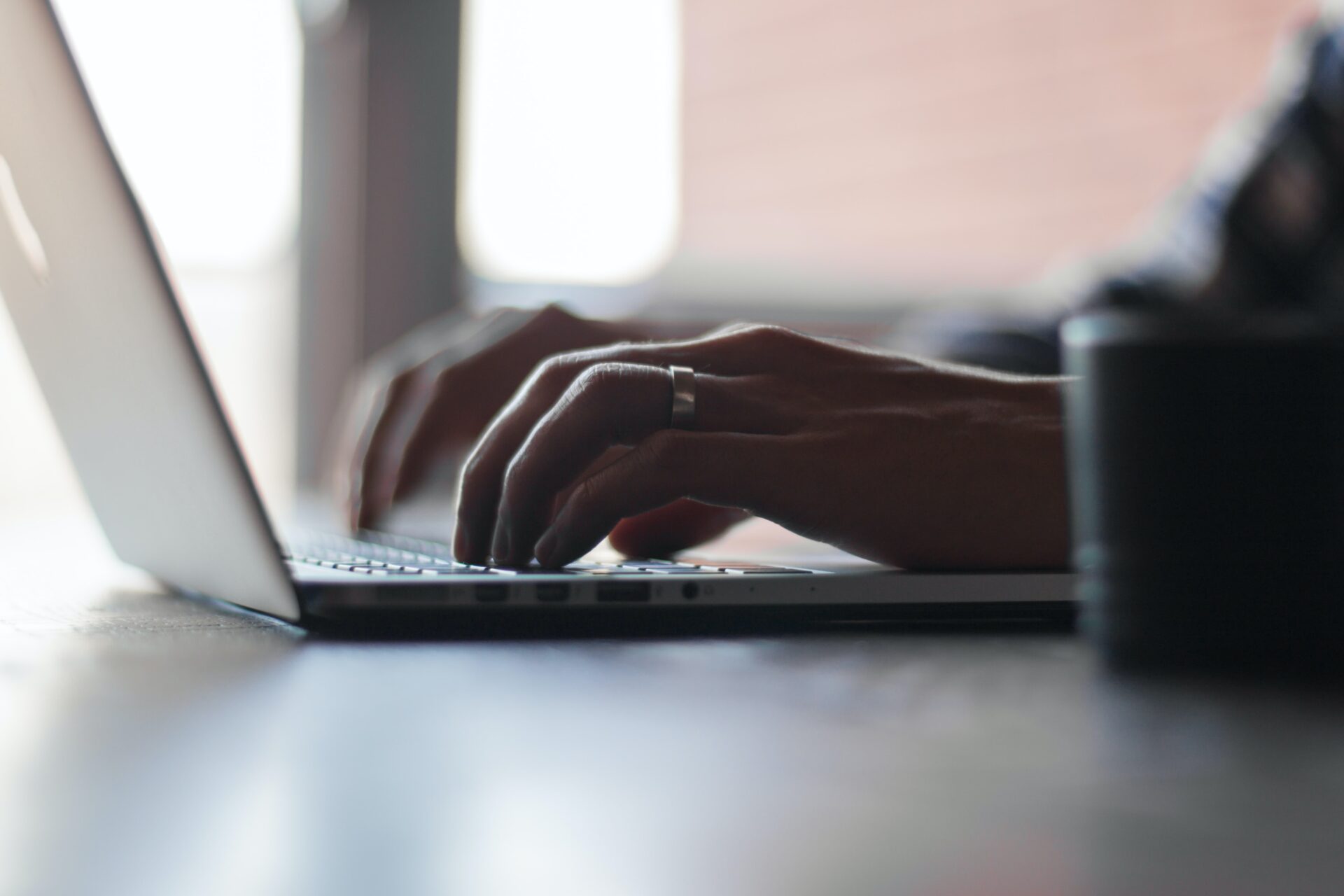 Fingers on a laptop keyboard photo by thomas-lefebvre-unsplash.jpg
